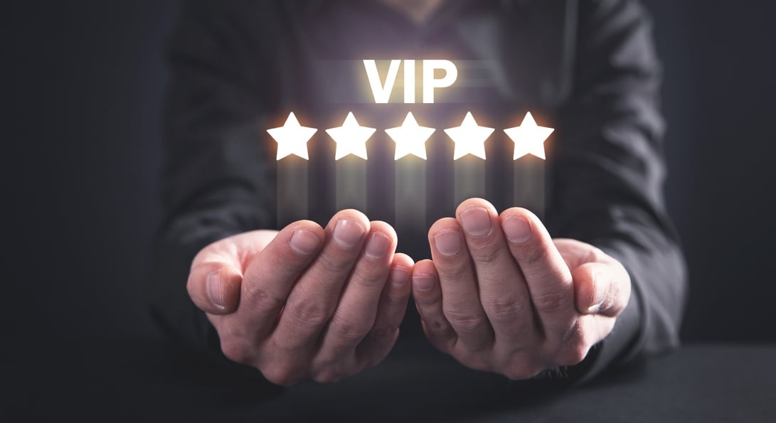 Man showing VIP word with five stars.