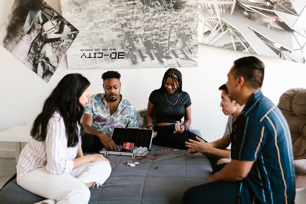 People in the Bedroom Playing Poker Game